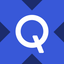 QCOMX